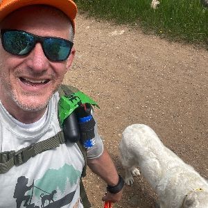 Michael on a hike with a dog