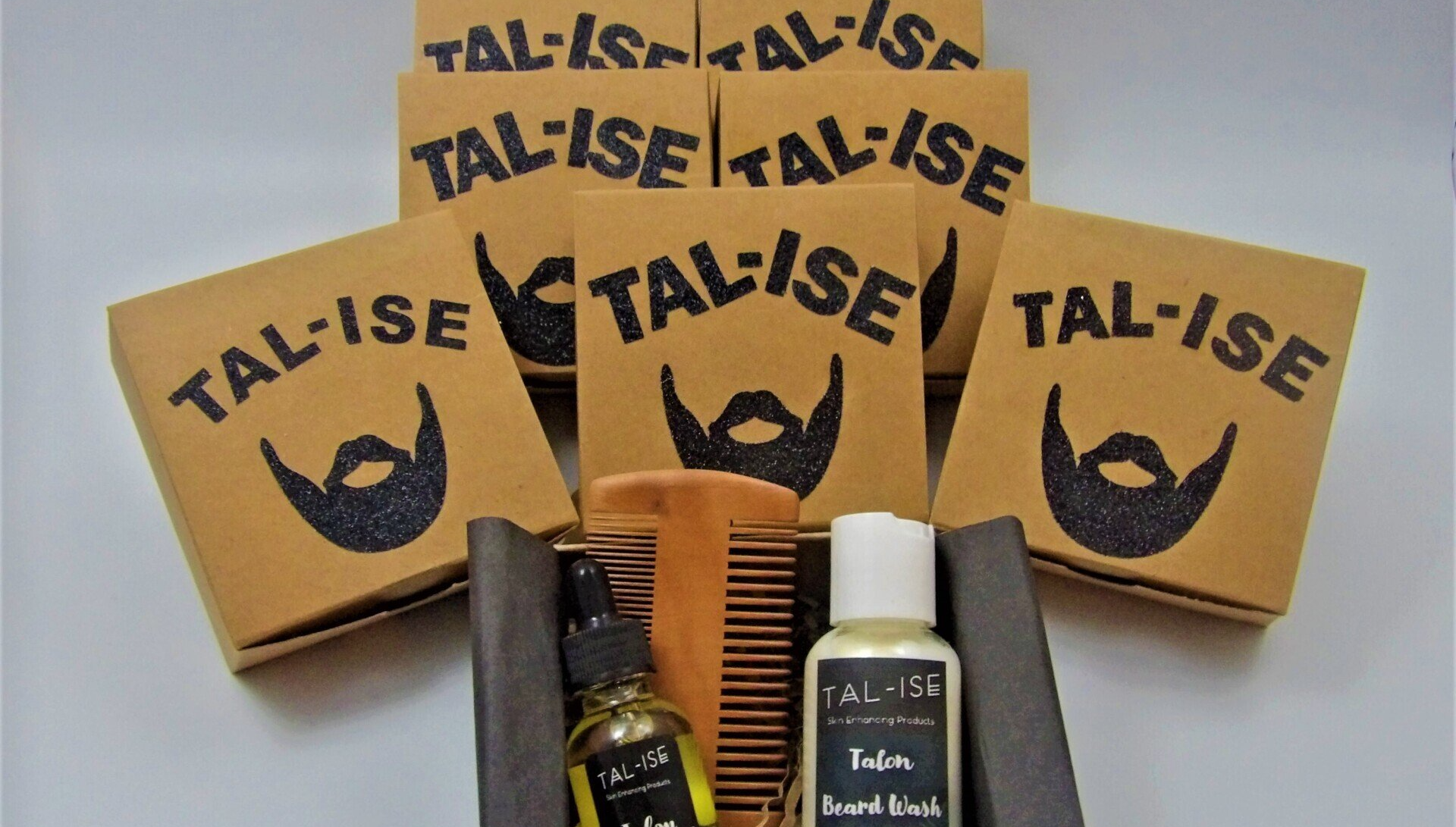 Men's beard kit made up of a beard wash, beard oil and 2-sided bamboo comb.
