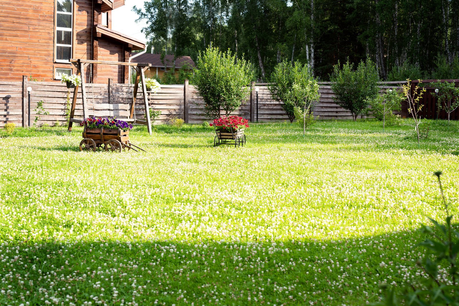 Rural garden with flower carts