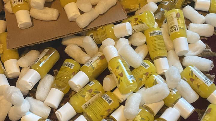 A pile of yellow bottles sitting on top of each other