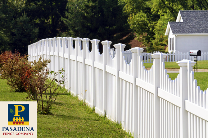 Professional Fence Installation Finished vinyl fenced-in yard with a green lawn, trees, and residential homes in the background