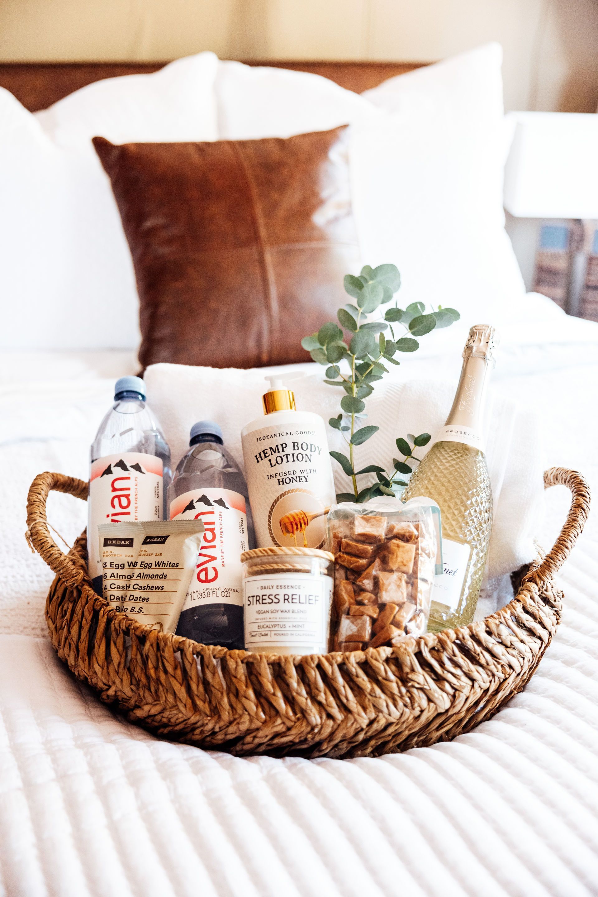 Woman and man on mountain bikes in a wooded area, smiling at each other.