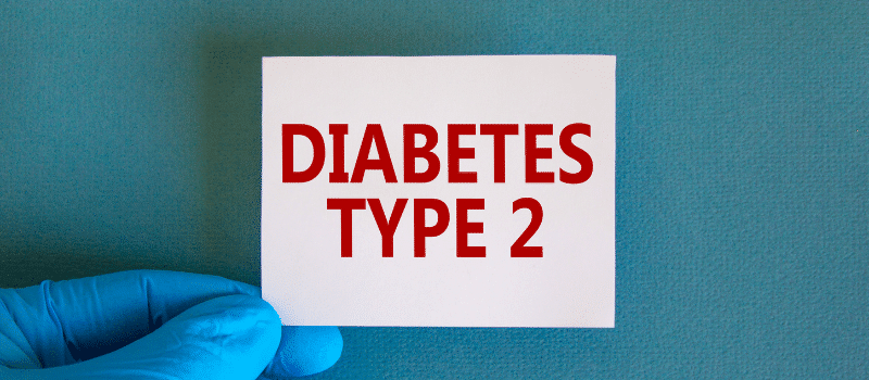 A person is holding a card that says `` diabetes type 2 ''.