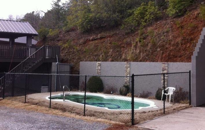Black Chain Link Around a Pool—Peak Fence System in Franklin, NC