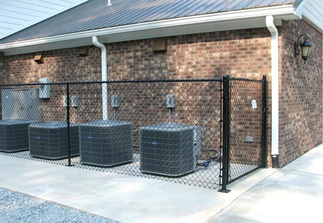 Black Chain Link on the Back of a House—Peak Fence System in Franklin, NC