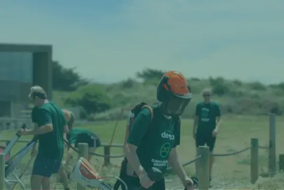 A group of people are riding bikes on a dirt road.