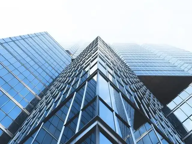 looking up at a tall building with a lot of windows