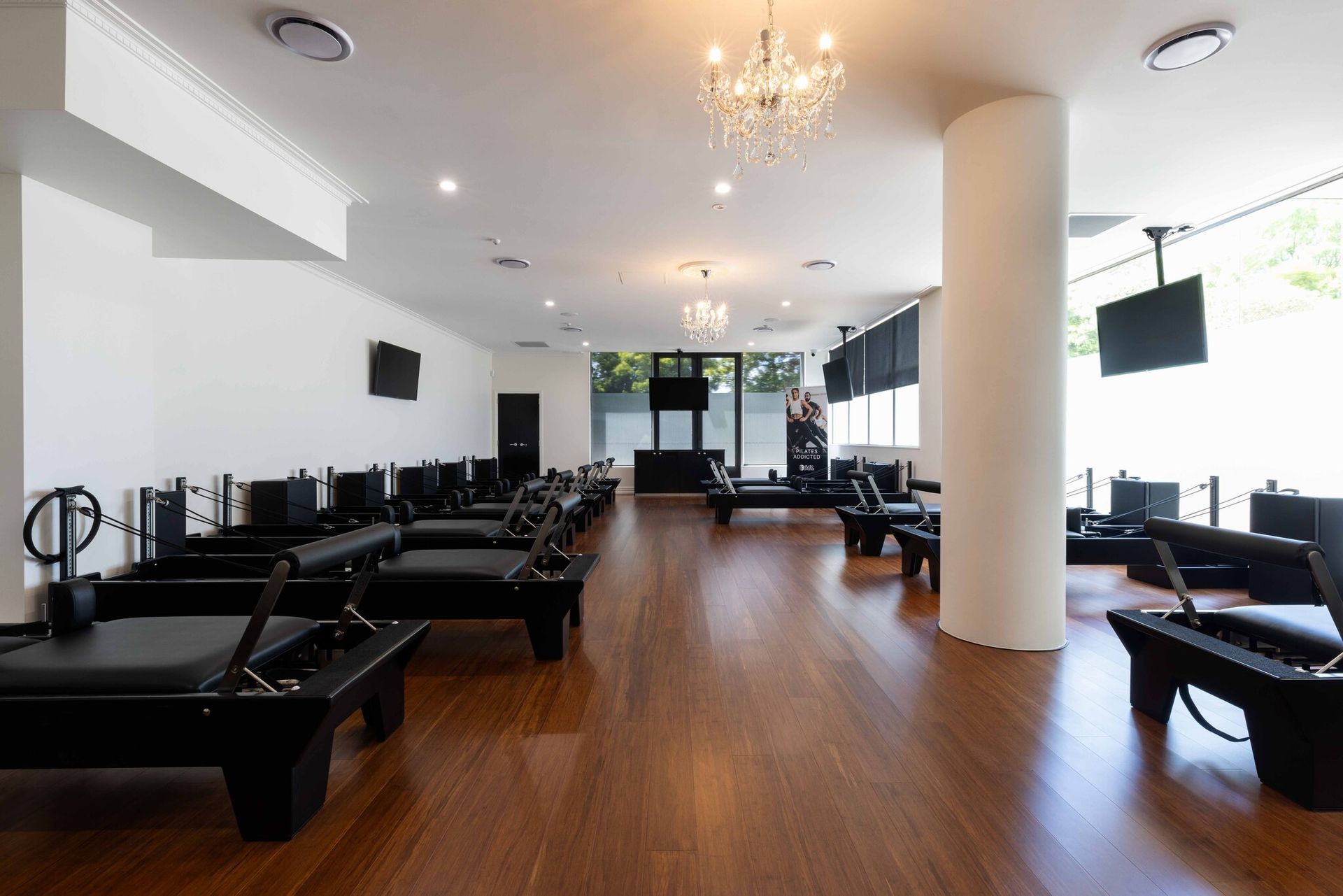 A large room with a lot of chairs and a chandelier.