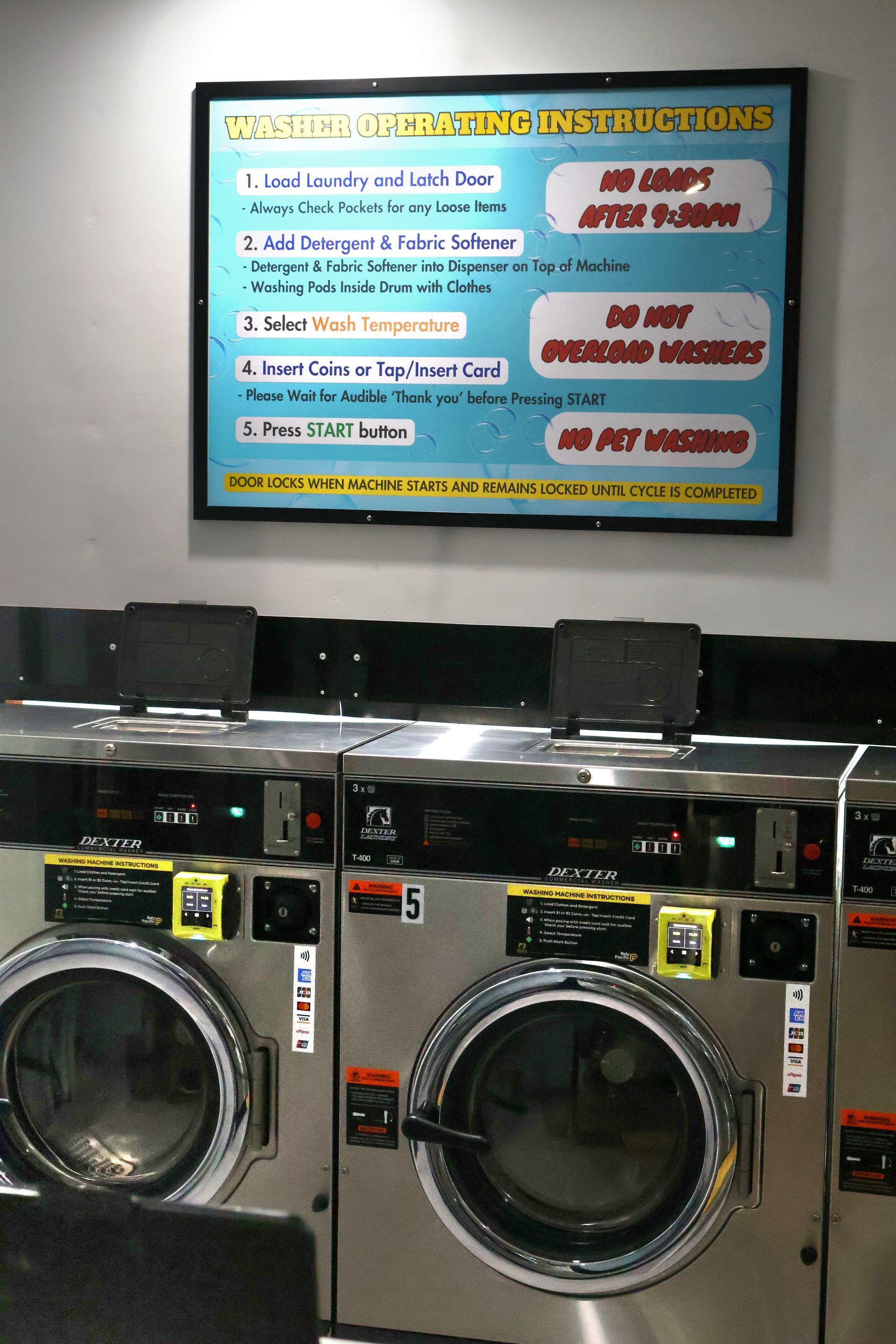 A Laundromat With A Stack Of Clothes On A Shelf — WashFold Laundromat In  Allenstown, QLD