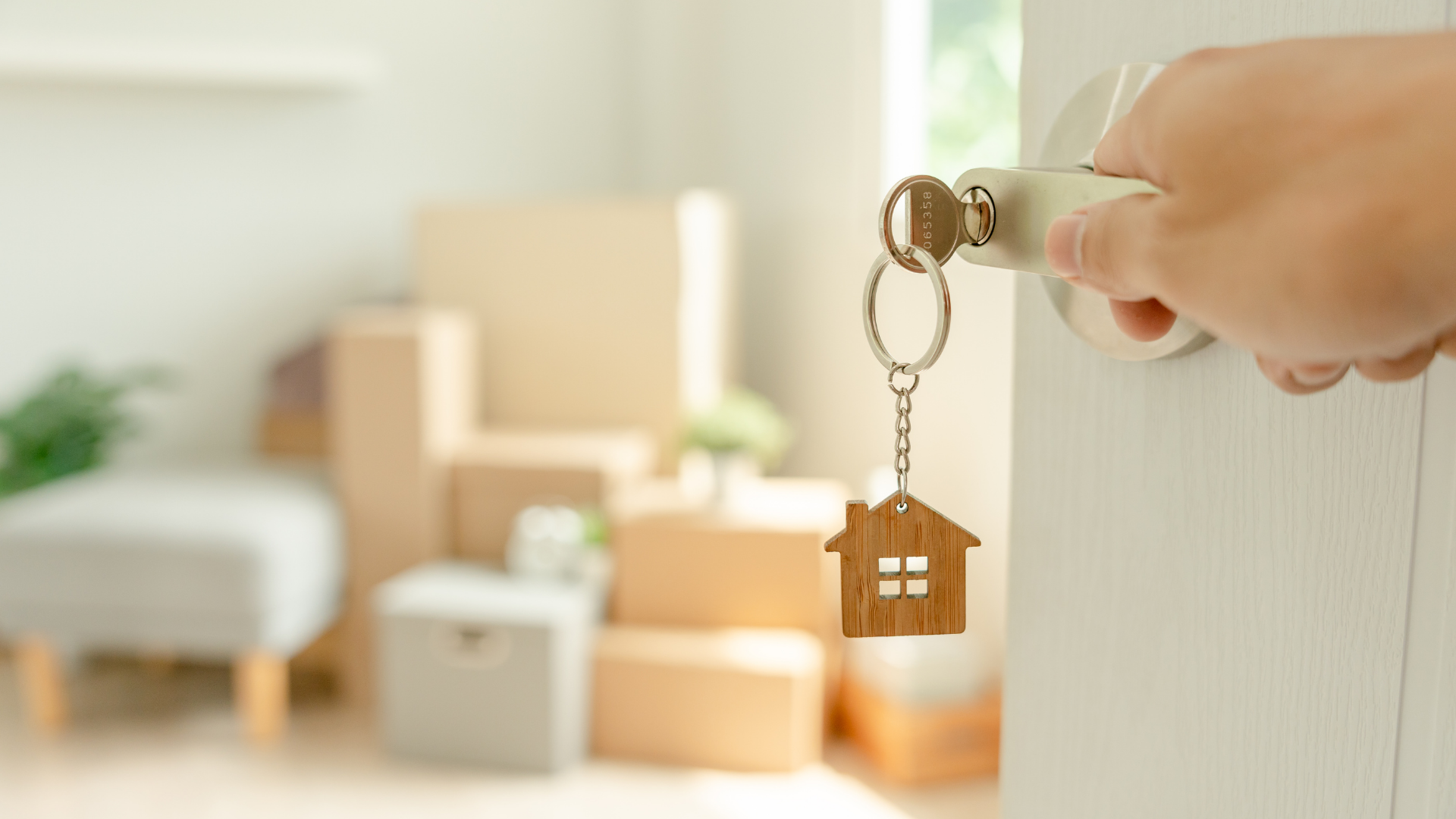 A person is opening a door with a key in it.