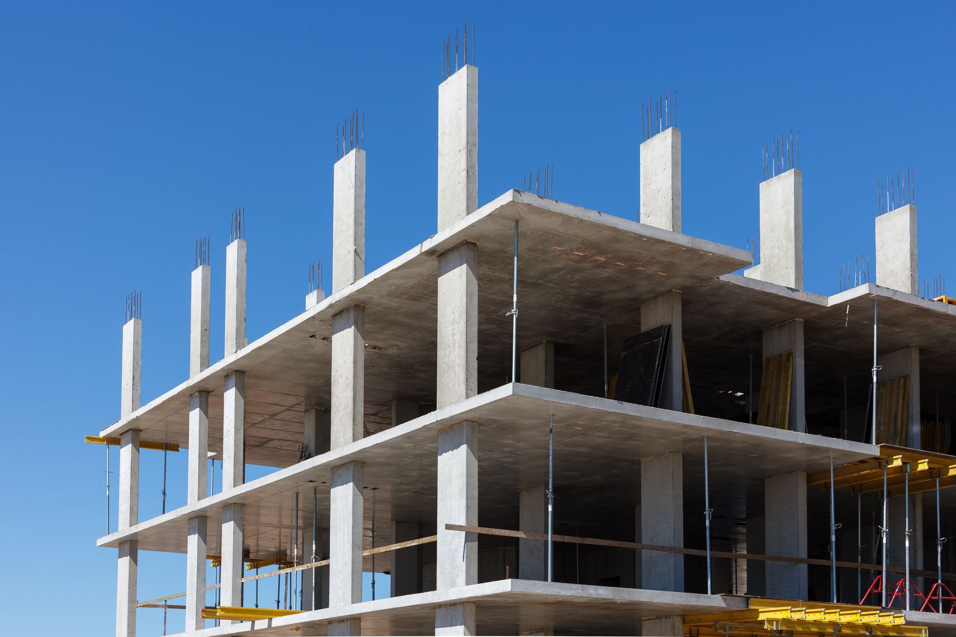 Reinforced concrete frame of a building under construction. Reinforced concrete frame of a building under construction.
