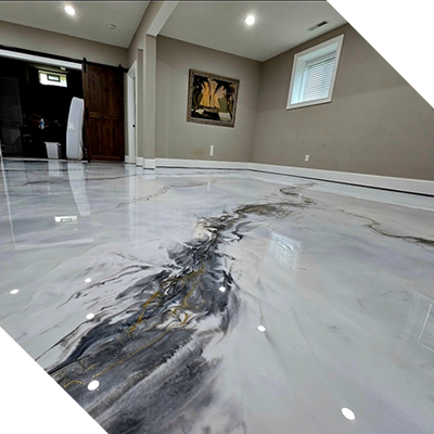 A room with a shiny metallic floor and a stone wall.