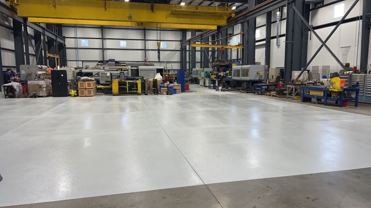 A large warehouse with a lot of machinery in it.