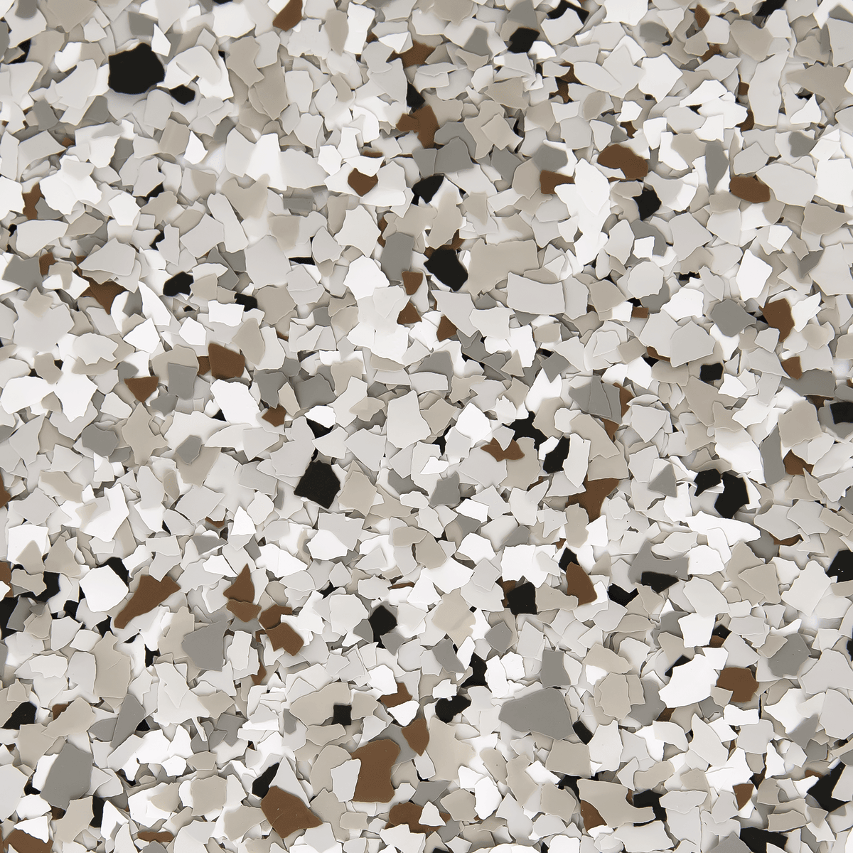 A close up of a pile of white , brown , and black gravel.
