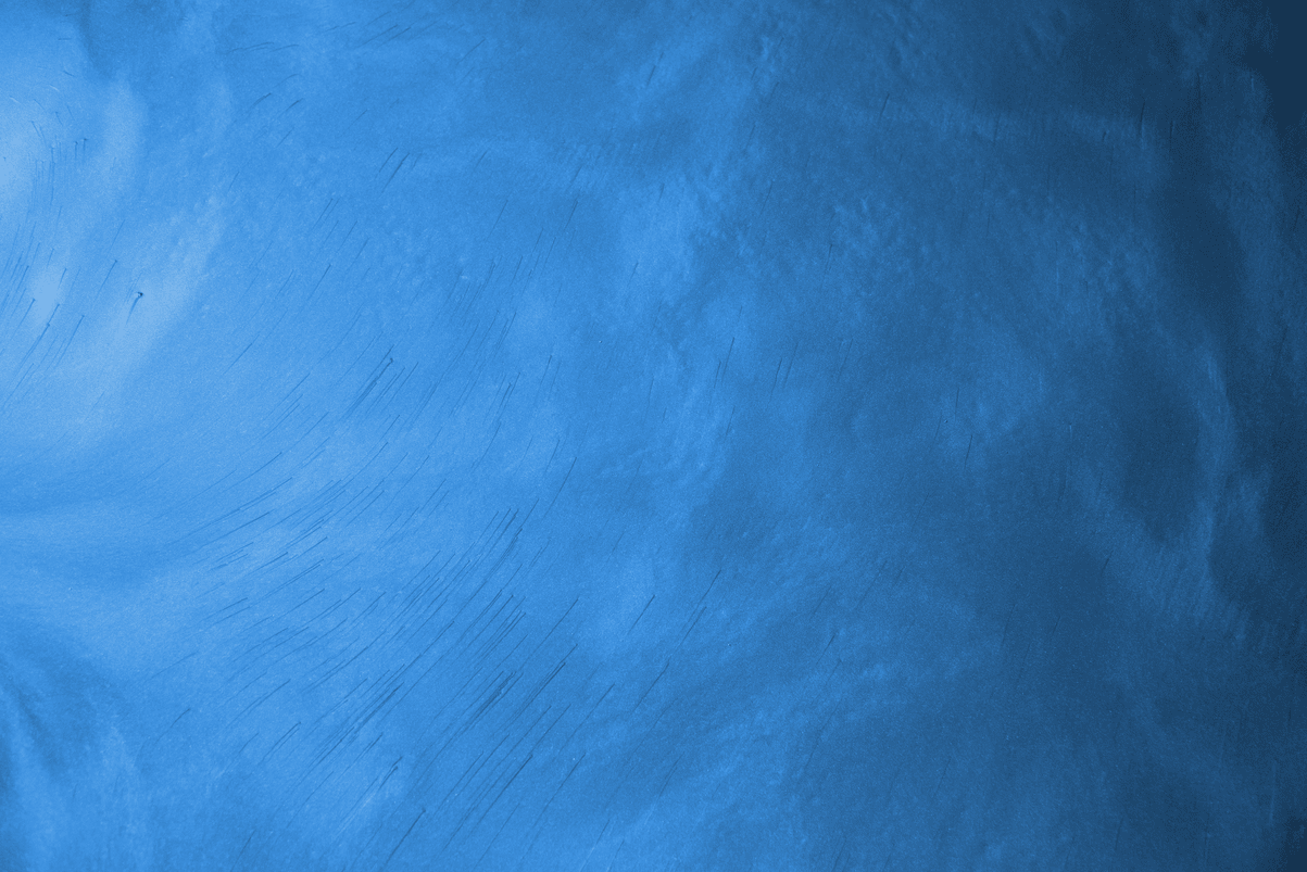 A close up of a blue background with a texture.