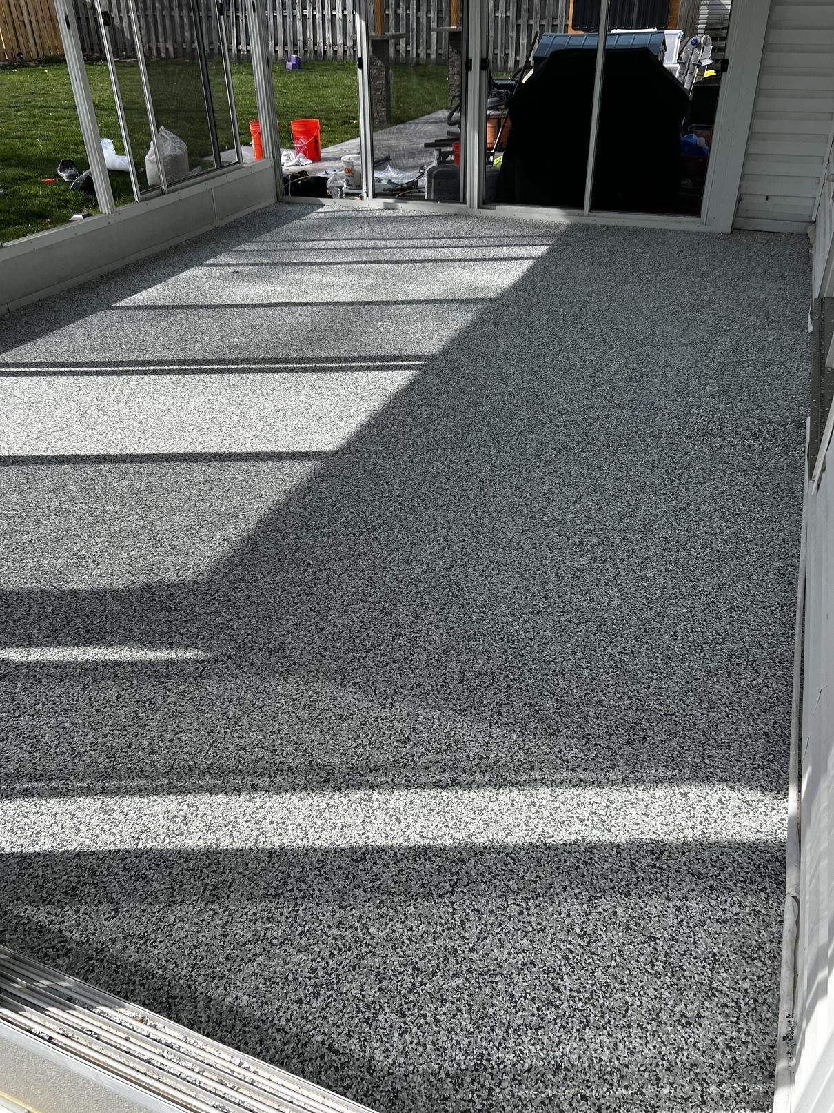 A concrete deck with stairs leading up to it.