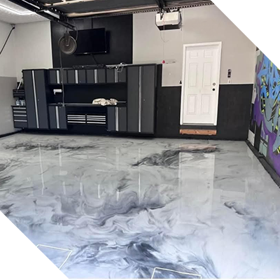 A garage with a shiny floor and gray walls.