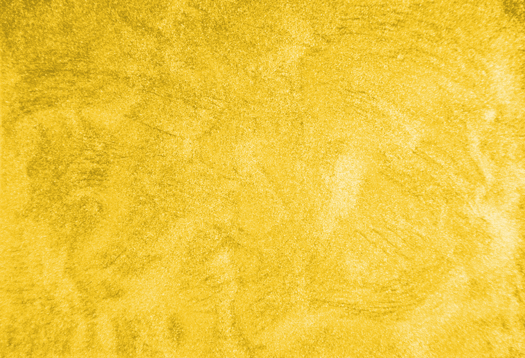 A close up of a yellow paper texture.