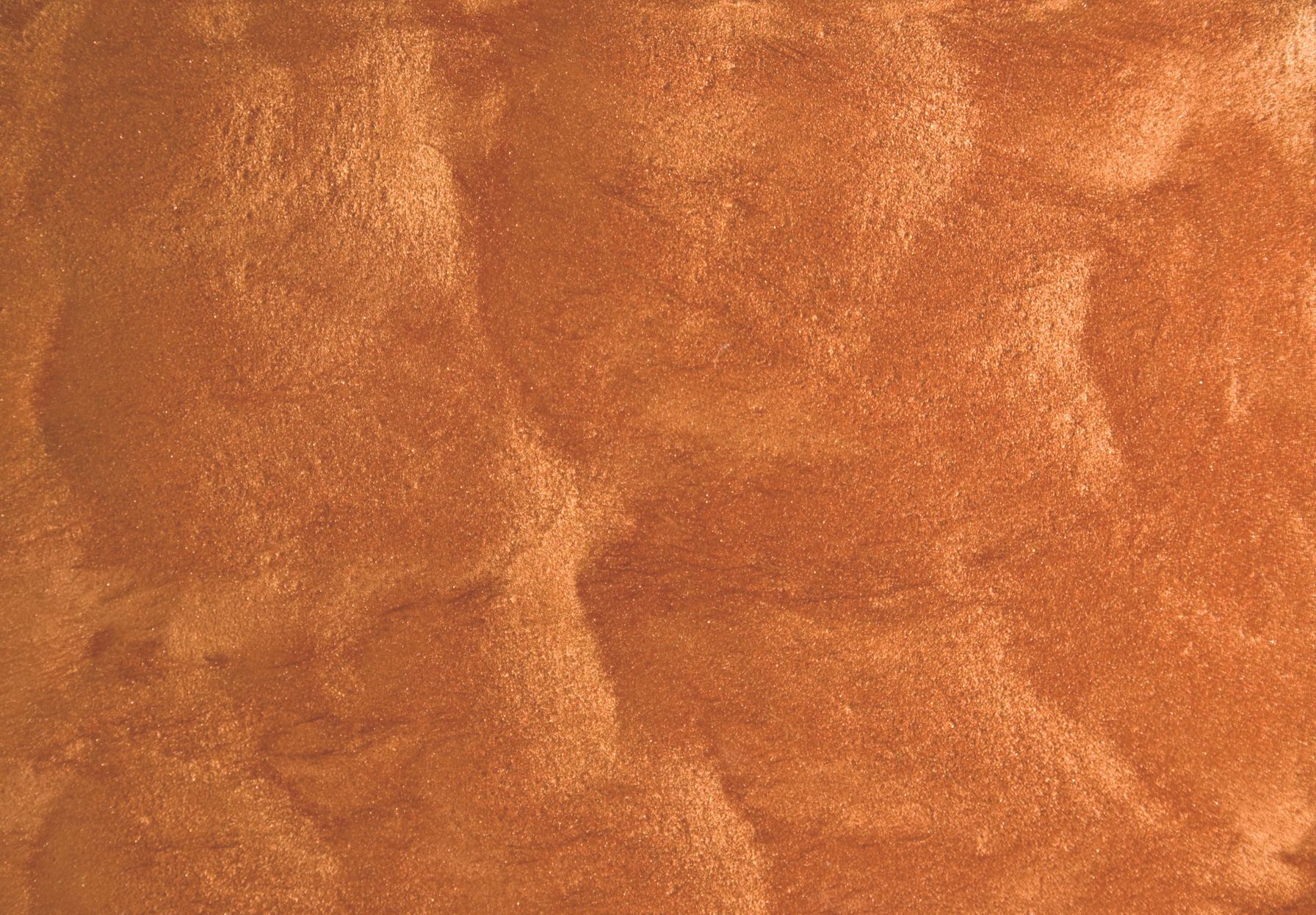 A close up of a brown surface with a shiny texture.
