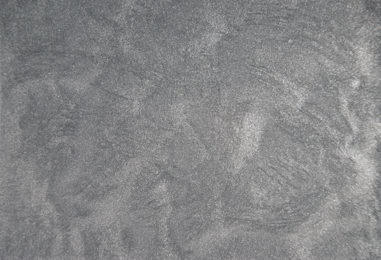 A close up of a gray carpet texture.