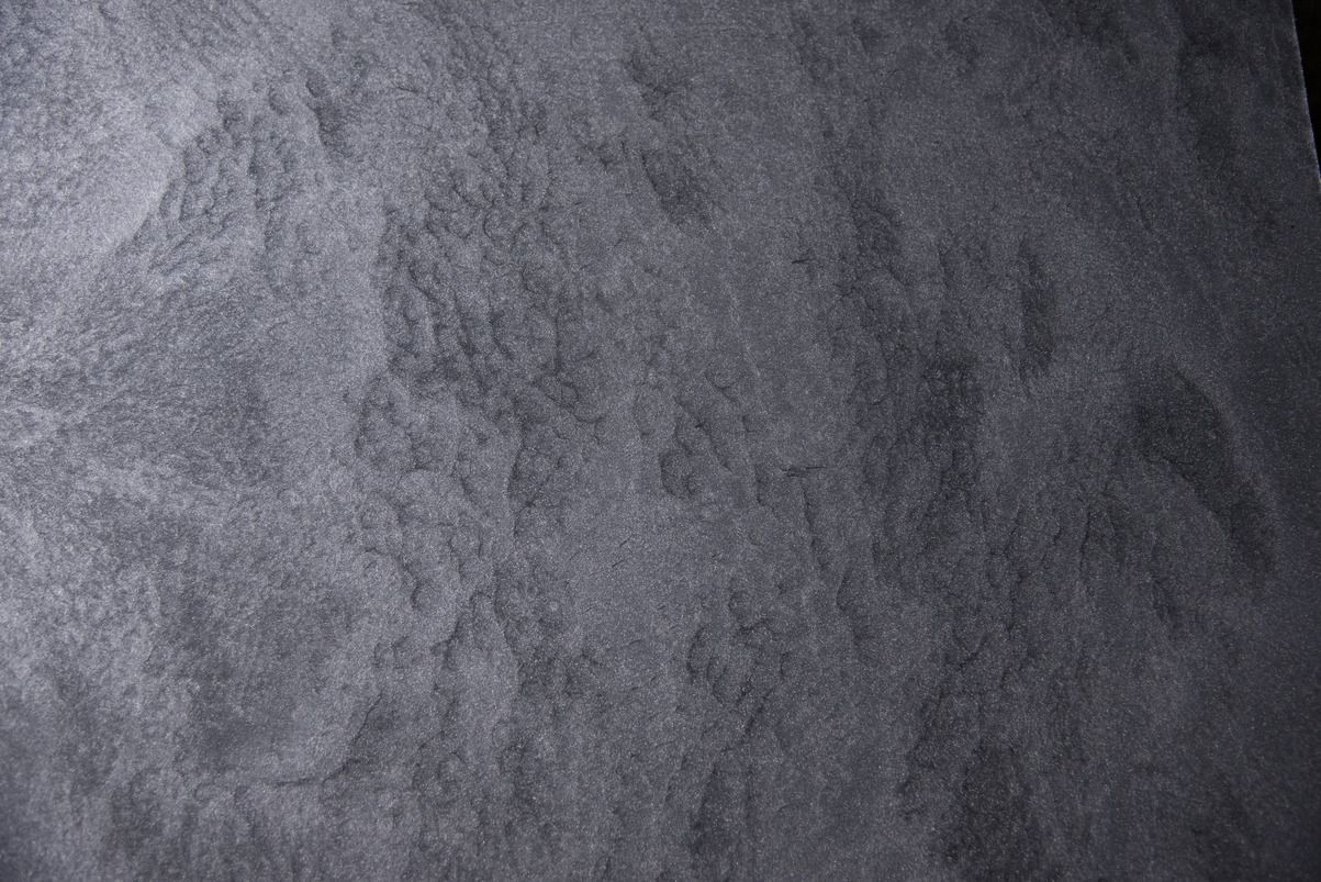 A close up of a piece of black paper.