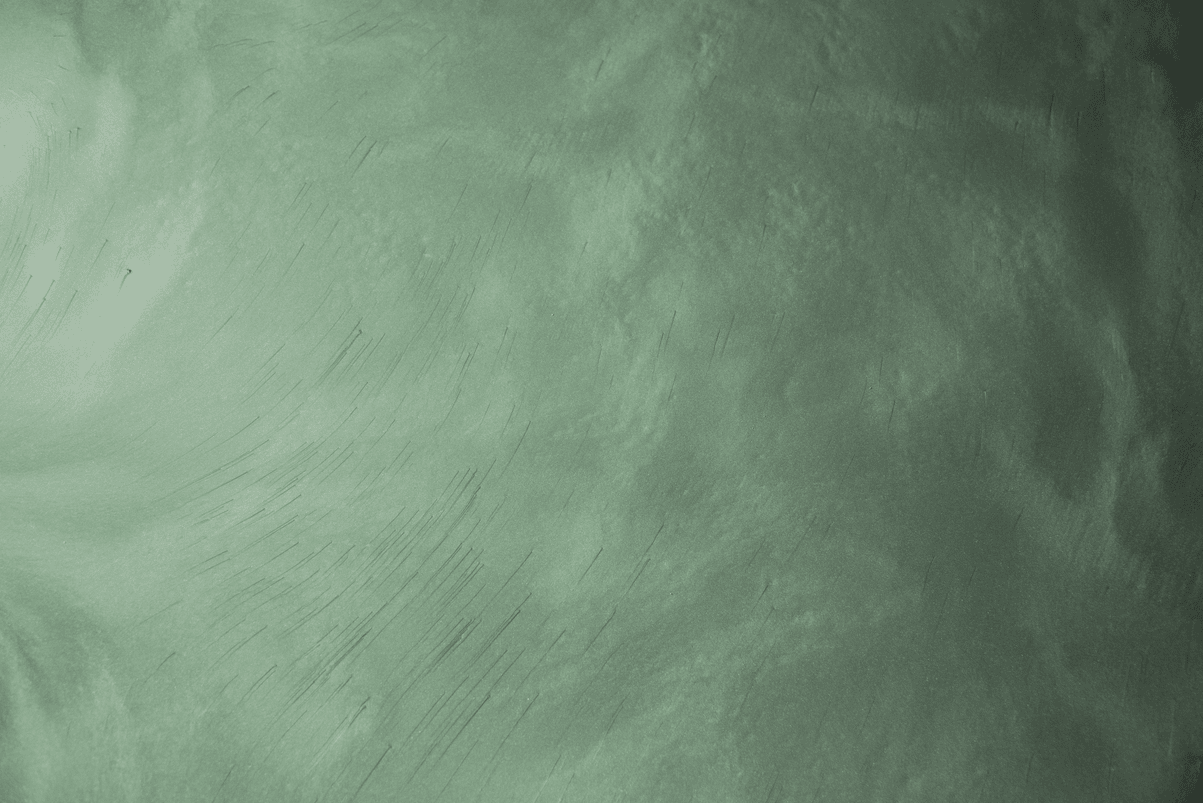 A close up of a green chalkboard texture.