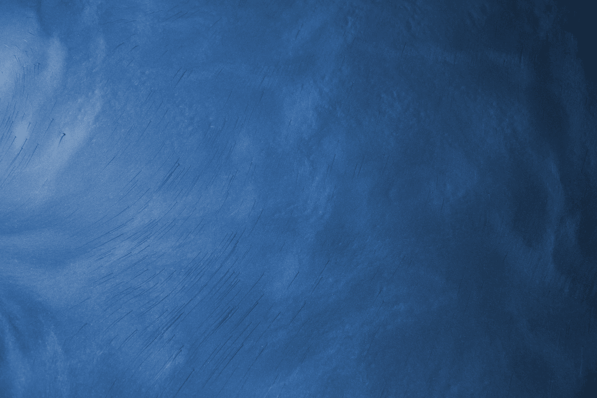 A close up of a blue chalkboard with white chalk on it.