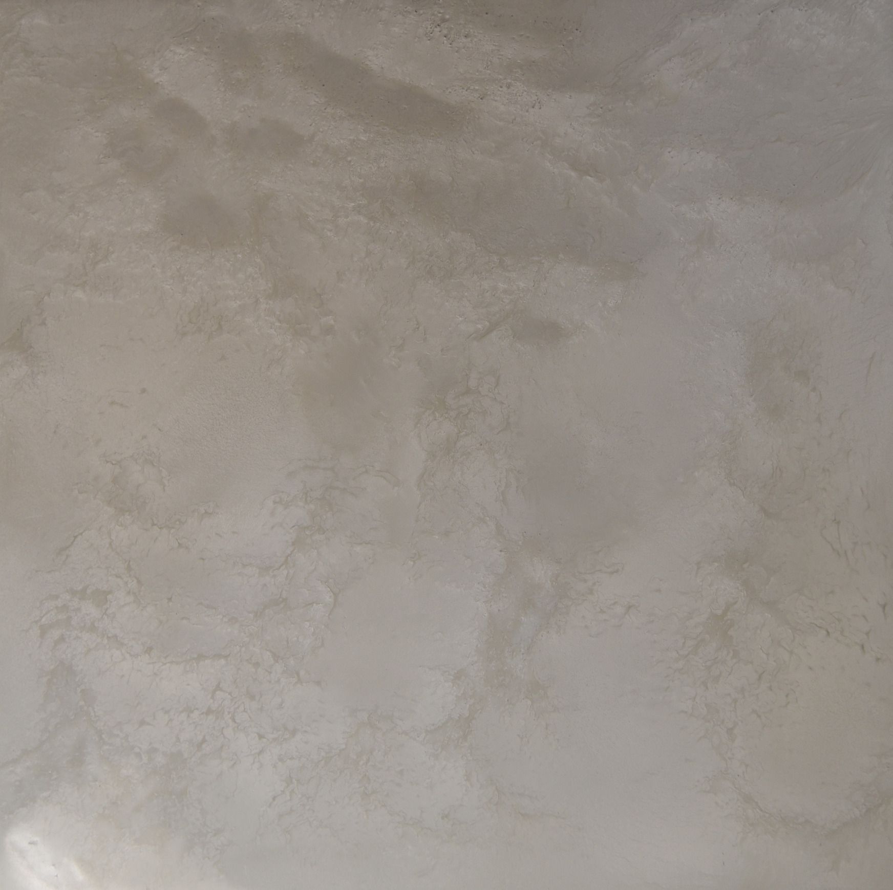 A close up of a gray tile with a marble texture.