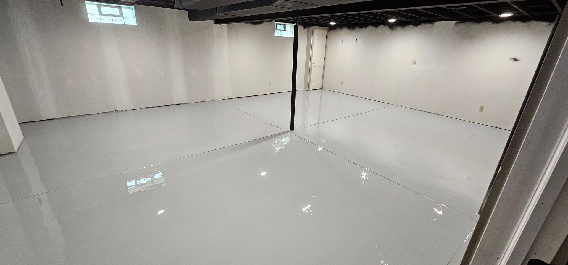 A large room with a white floor and walls.