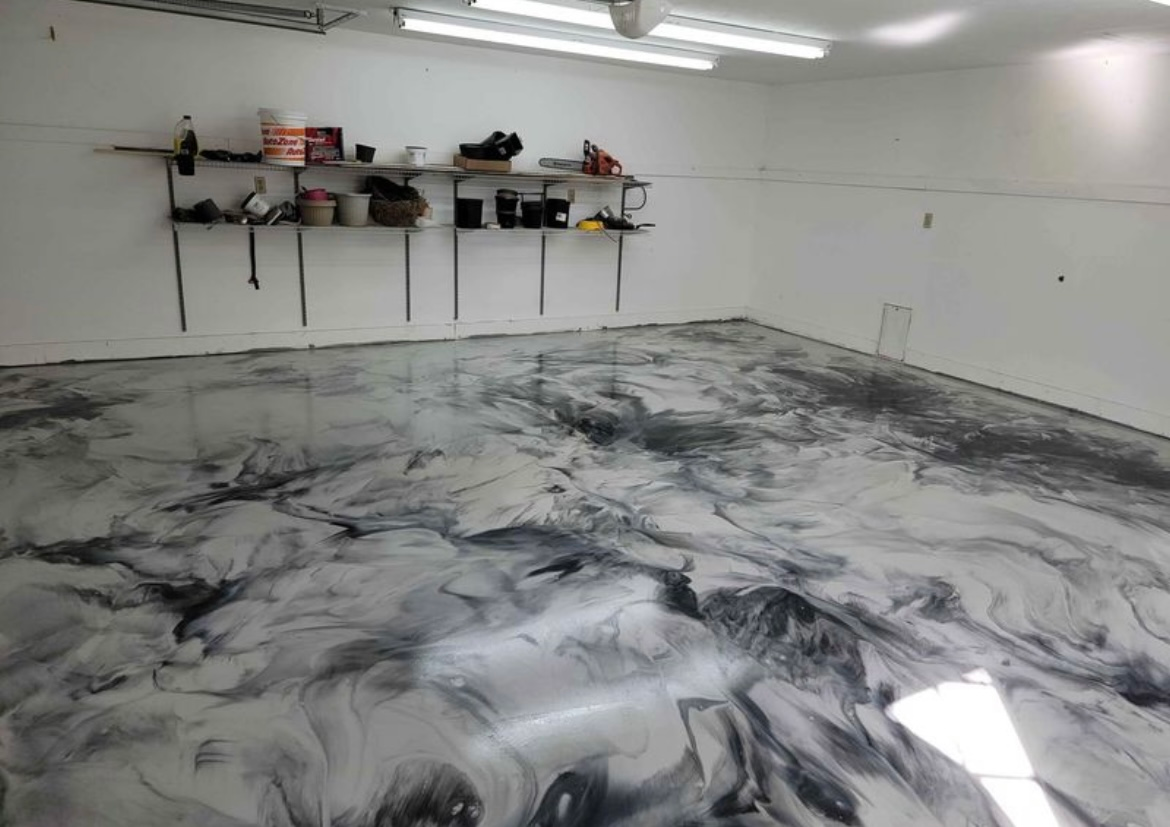 A garage with a marble floor and shelves.