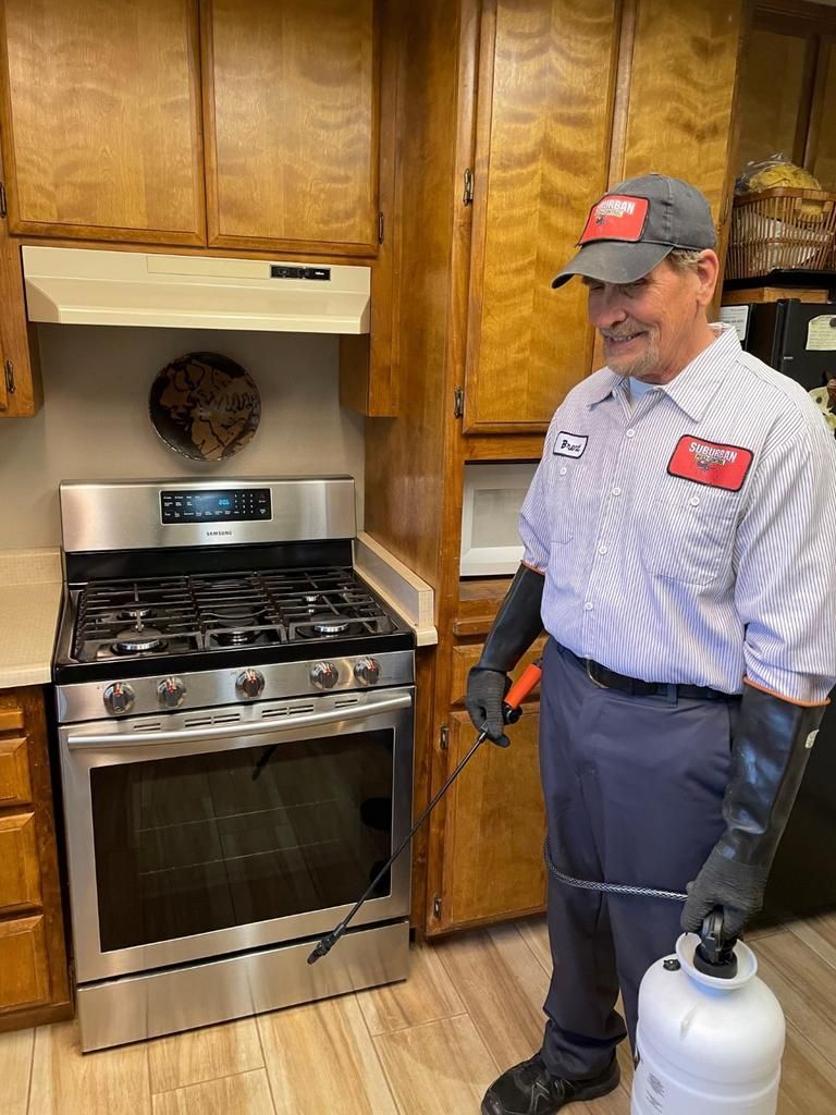 a man holding pest control