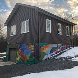 Grey two storey garage for four car
