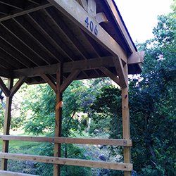 old wooden bridge with roof