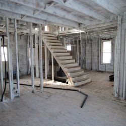 There is a staircase in the middle of the room.