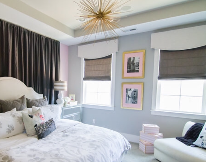 A bedroom with a bed and a couch in it