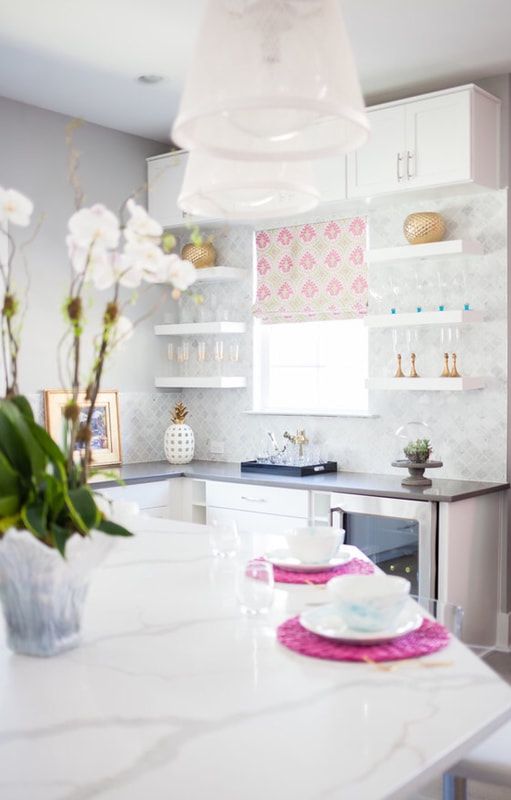 A kitchen with a table and plates on it