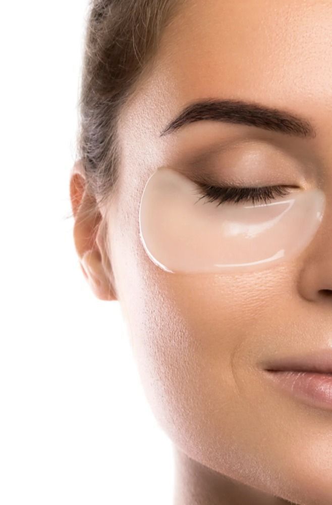 Woman wearing a clear gel eye patch with closed eyes.