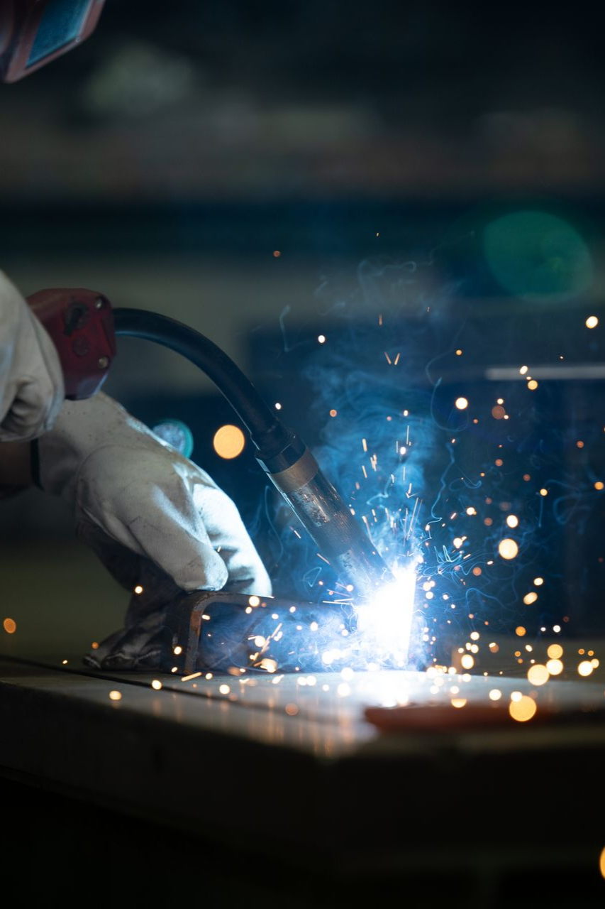Close-up of welding sparks during residential ironworks fabrication. Close-up of welding sparks during residential ironworks fabrication.