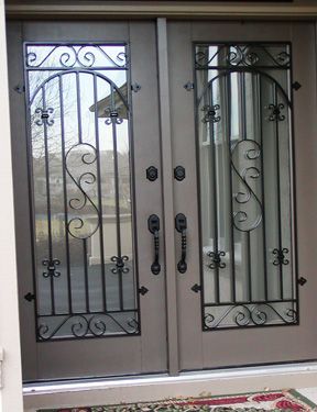 A door with a wrought iron design on it