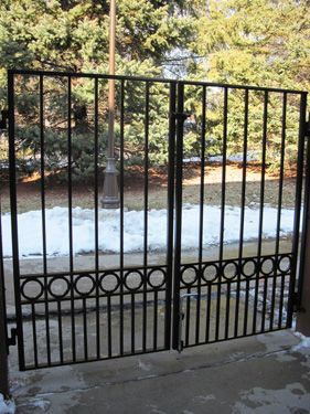 A wrought iron gate with circles on it