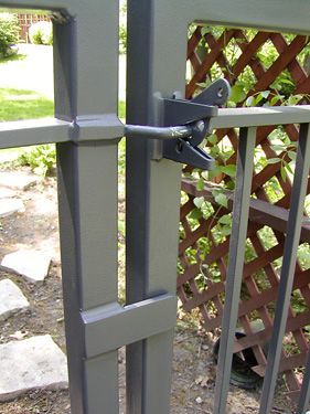 A close up of a gate with a latch on it