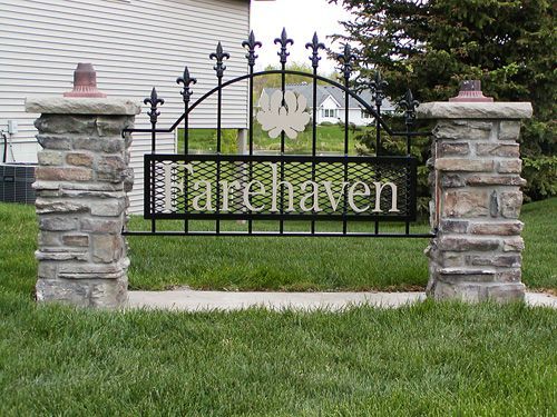 A wrought iron gate with the word harehaven on it