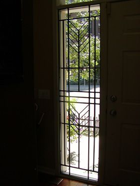 A door with a wrought iron design on it