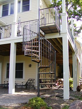 A house with a spiral staircase leading up to the second floor