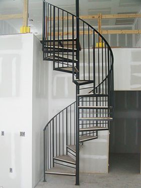 A spiral staircase in a building under construction