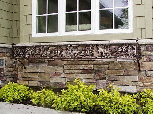 A house with a stone wall and a window