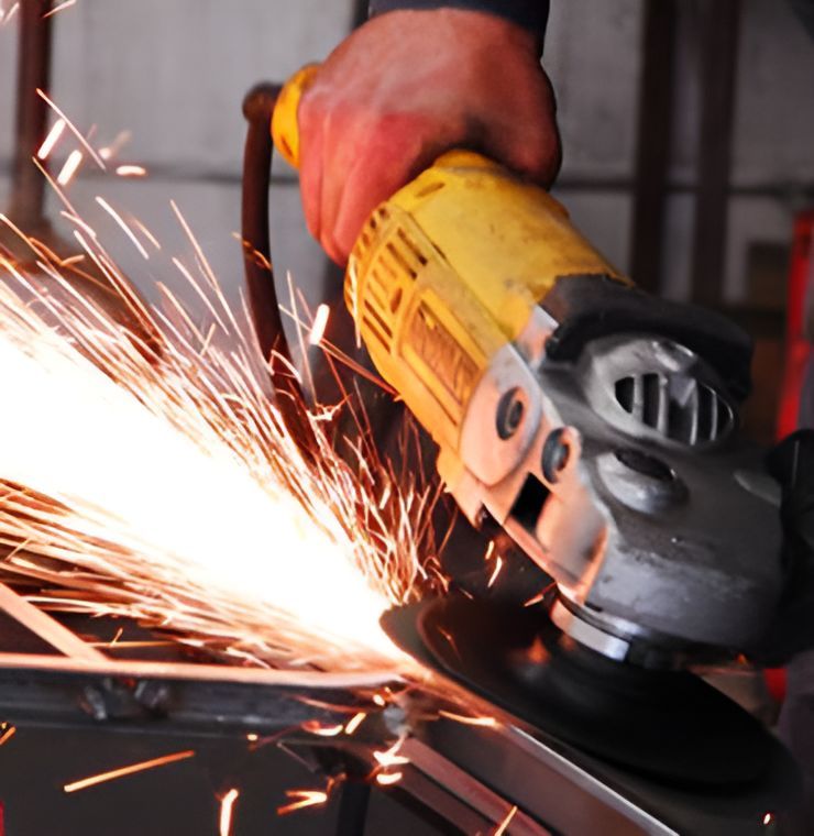 Strong man working in a steel factory workshop