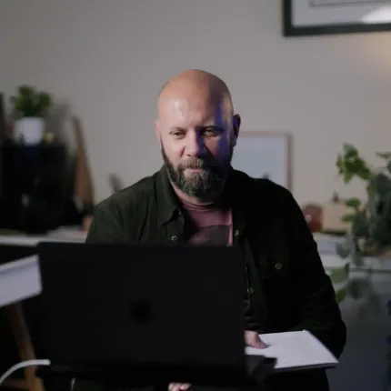 Photo of Matt Elliott at work during a strategy call