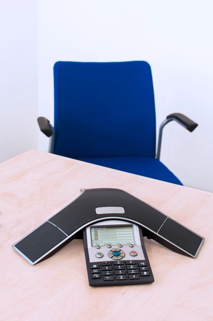 Attorney answering a client phone call in a modern law office