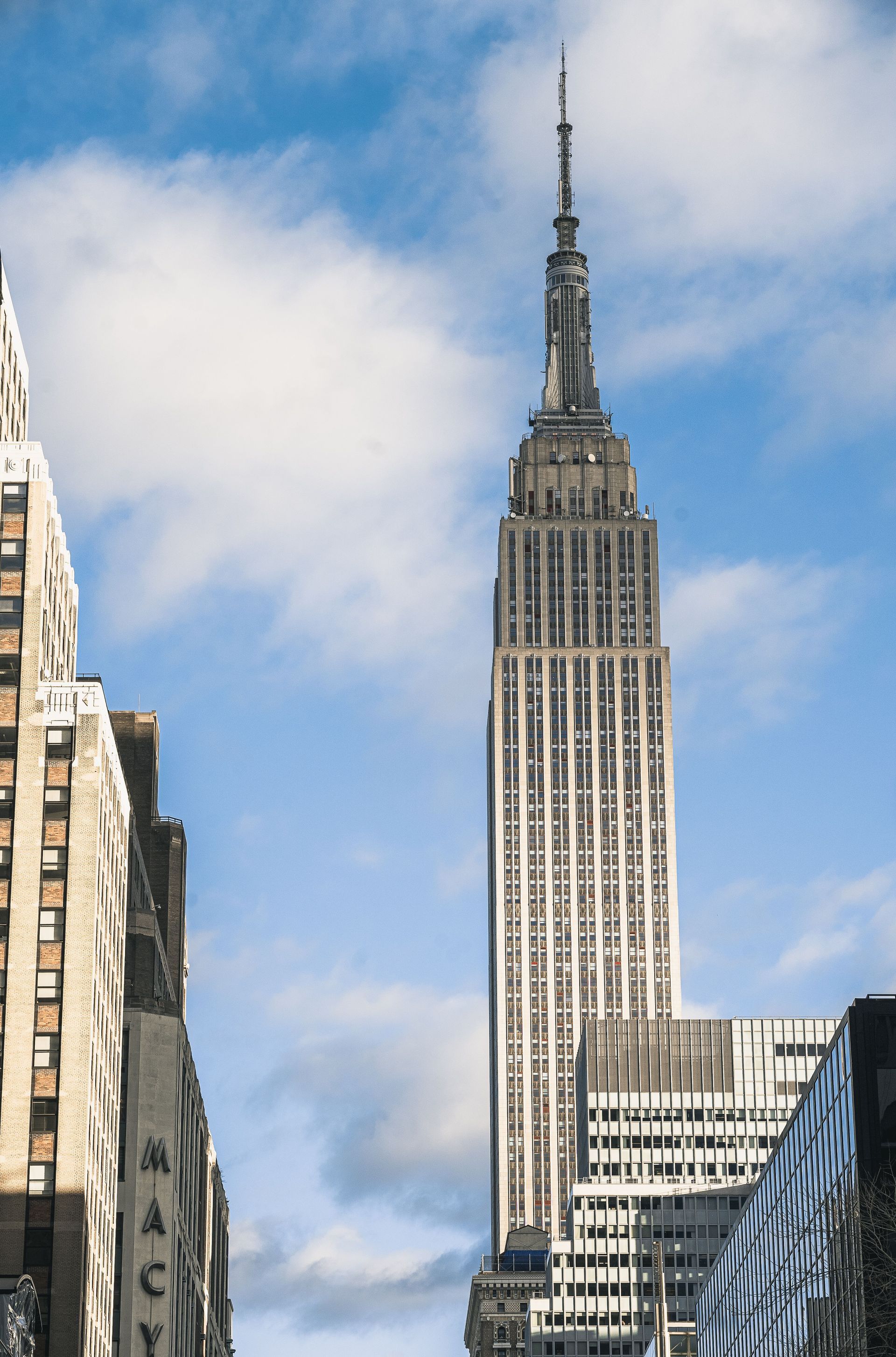 Empire State Building spire against a clear blue sky in New York City